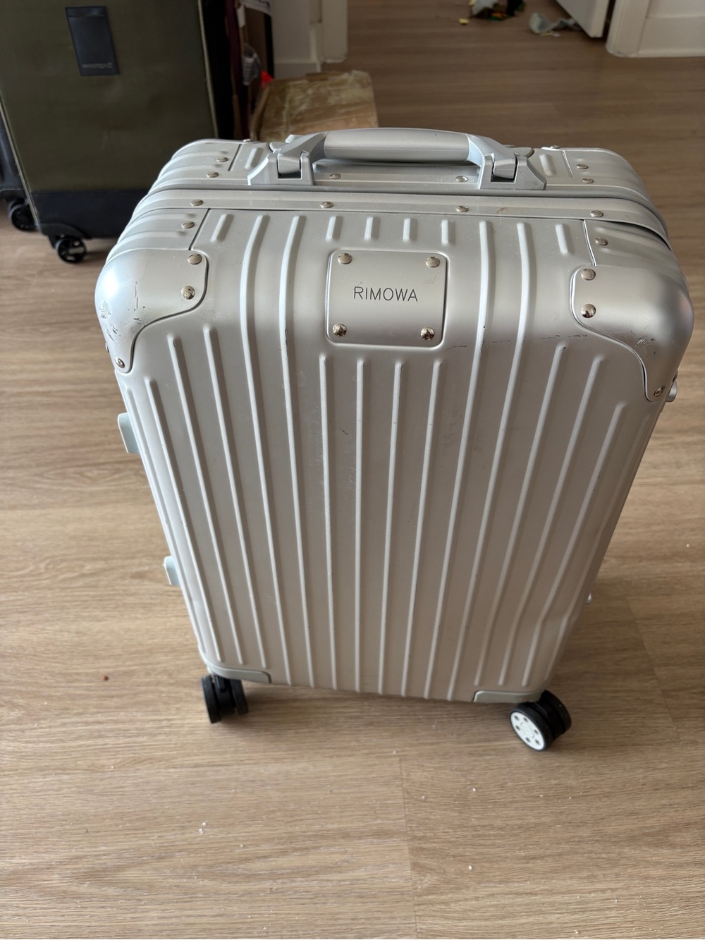 RIMOWA Silver Hard-Shell Carry-On with Spinner Wheels